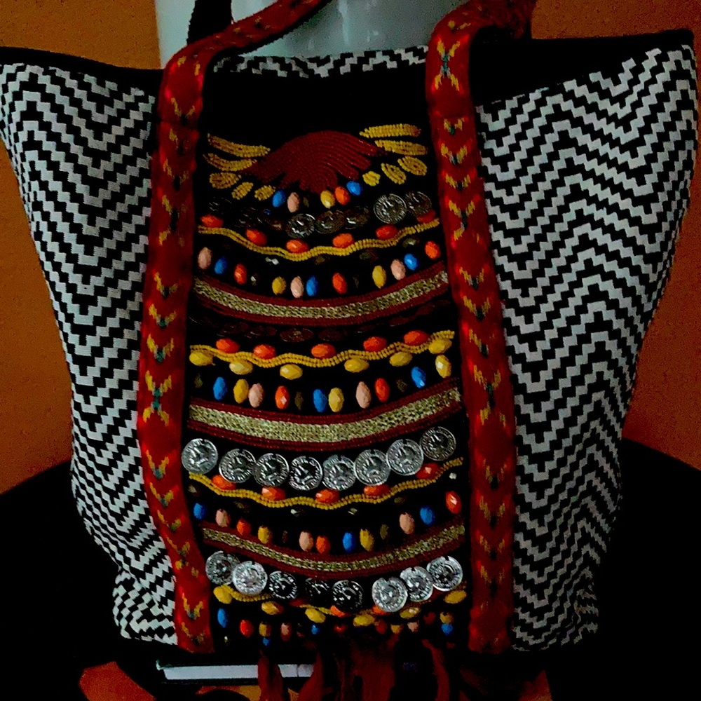Bohemian style shoulder bag with straps.